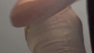 Redhead co-ed slowly strips to lingerie while cleaning her room.