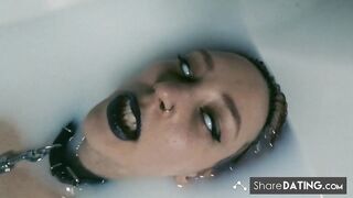 Tattooed BDSM Babe in Latex and Milk Bath